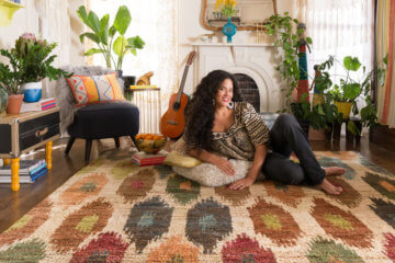 girl sitting carpet